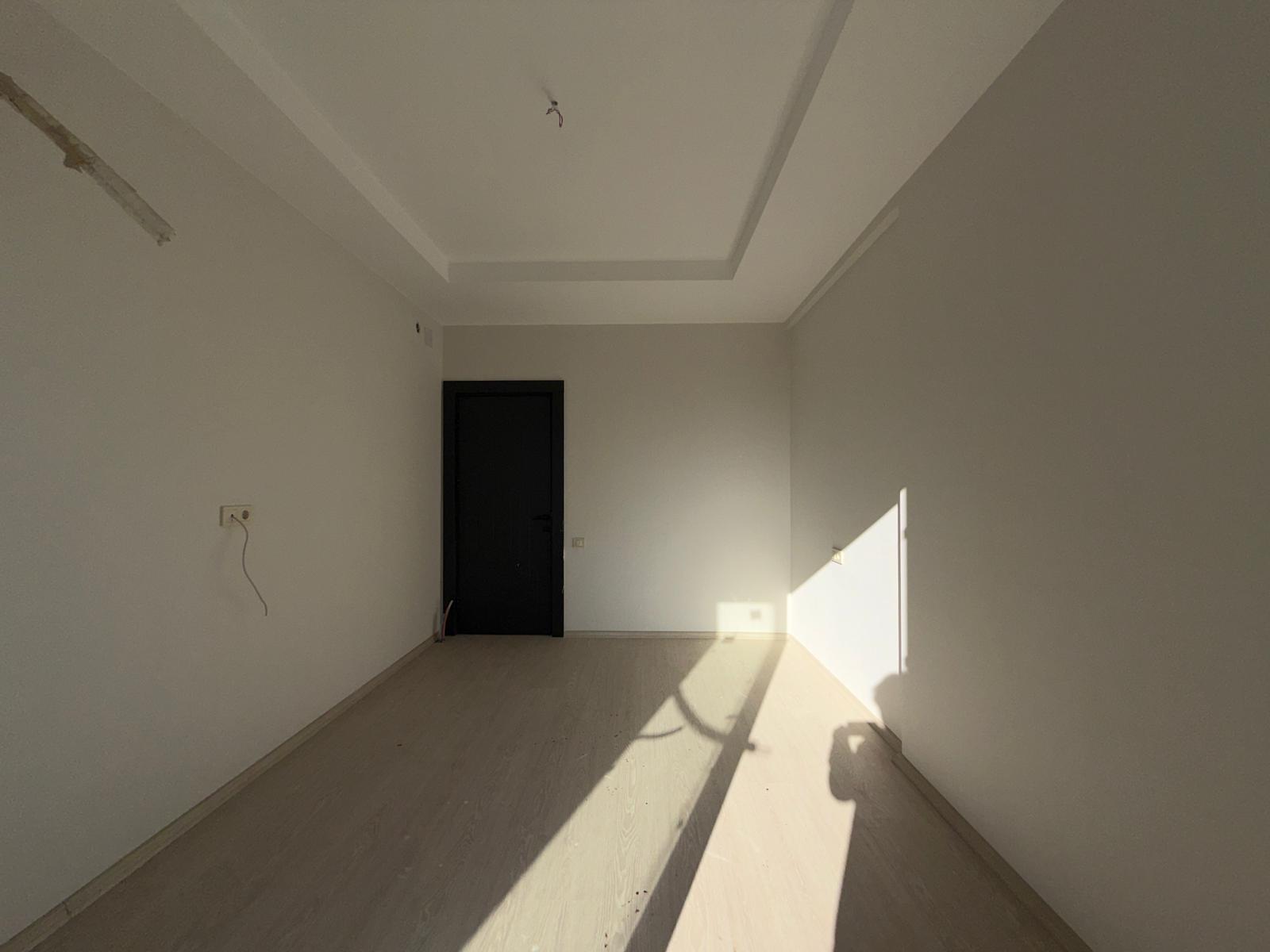 Moderne 1+1 lejlighed til salg i Mersin Tomuk nær havet