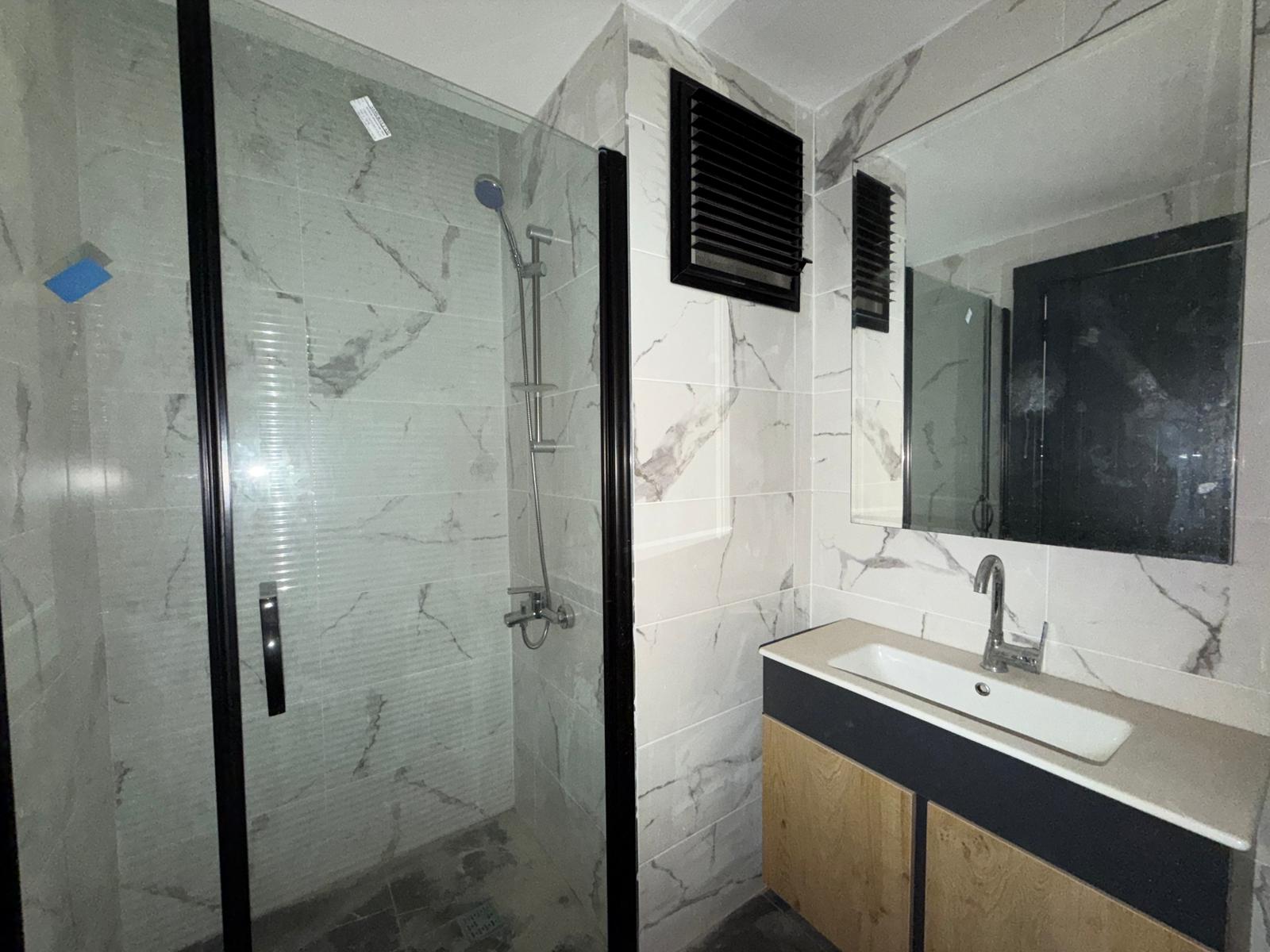 Moderne 1+1 lejlighed til salg i Mersin Tomuk nær havet