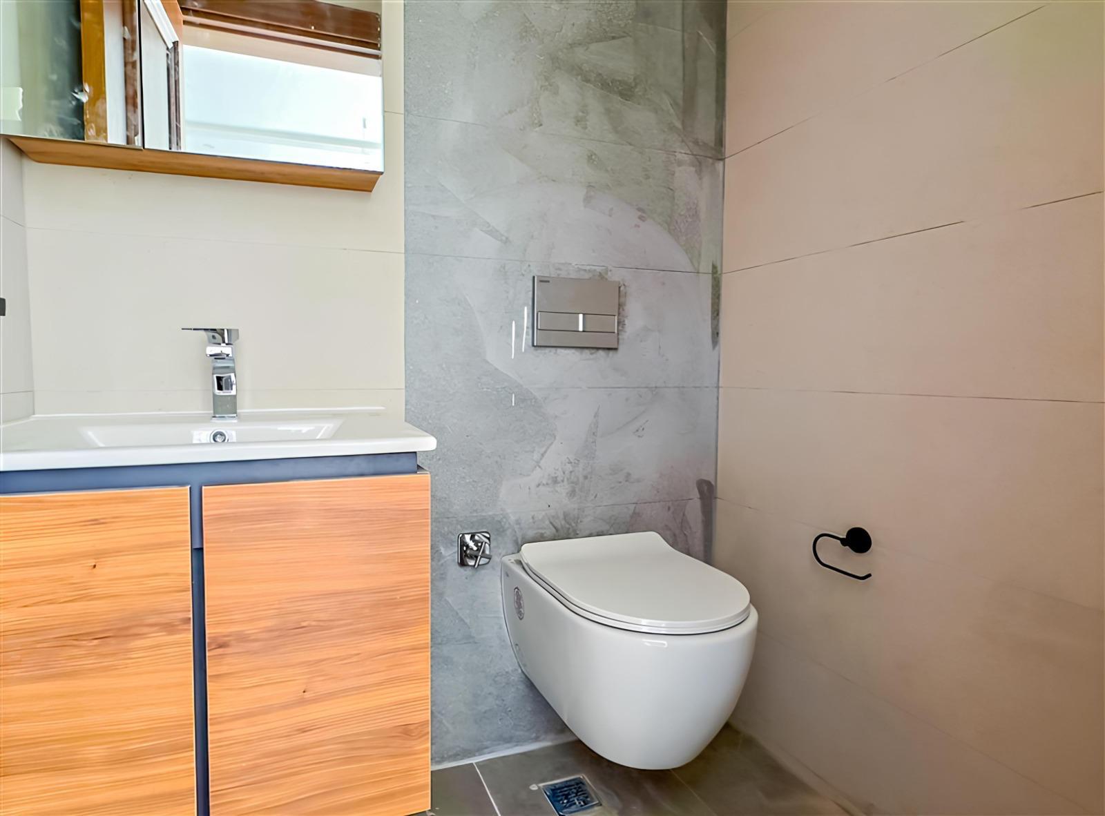 Spacious Modern Apartment for Sale in Hasbahce Alanya with Extensive Facilities