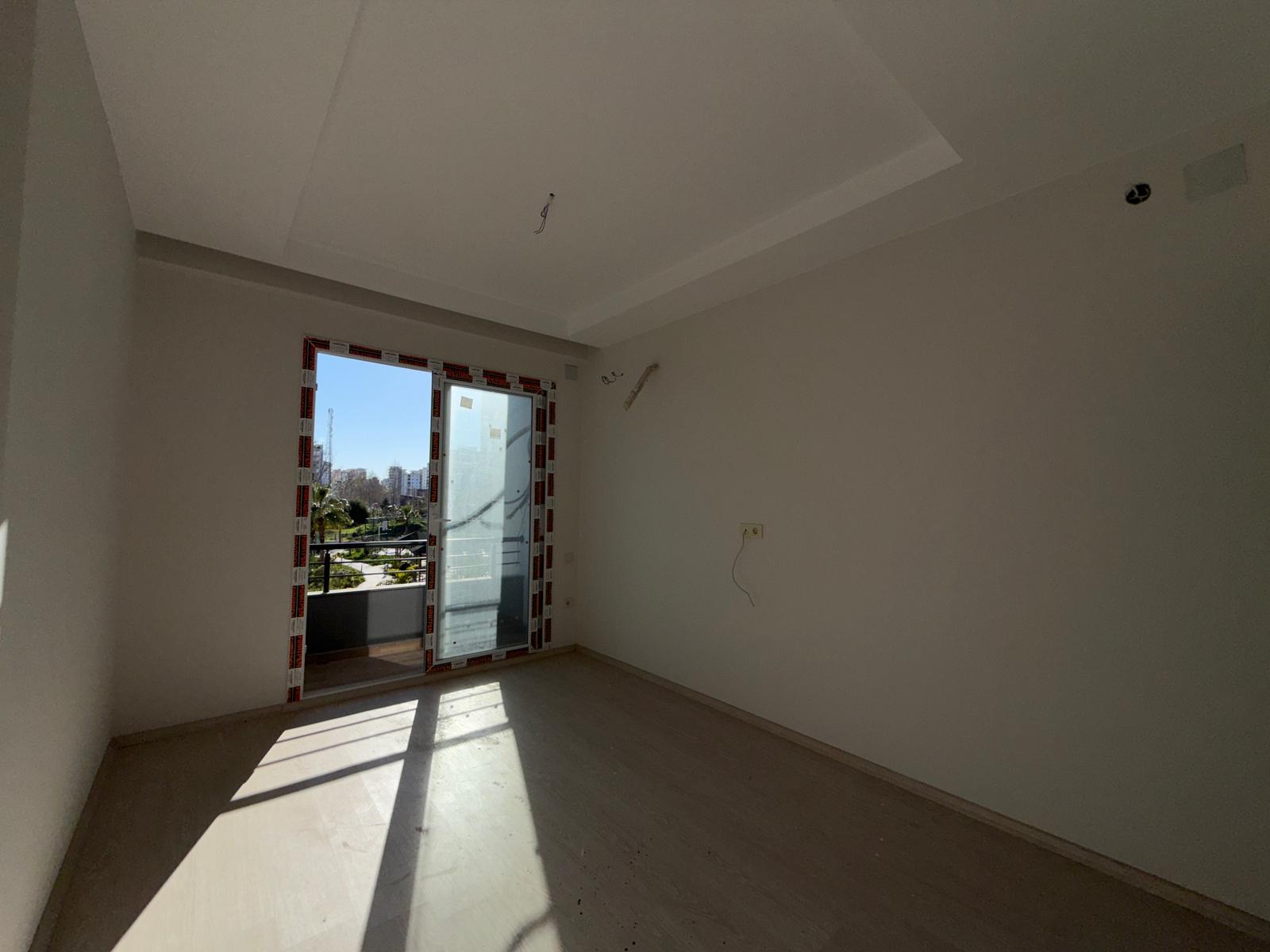 Moderne 1+1 lejlighed til salg i Mersin Tomuk nær havet