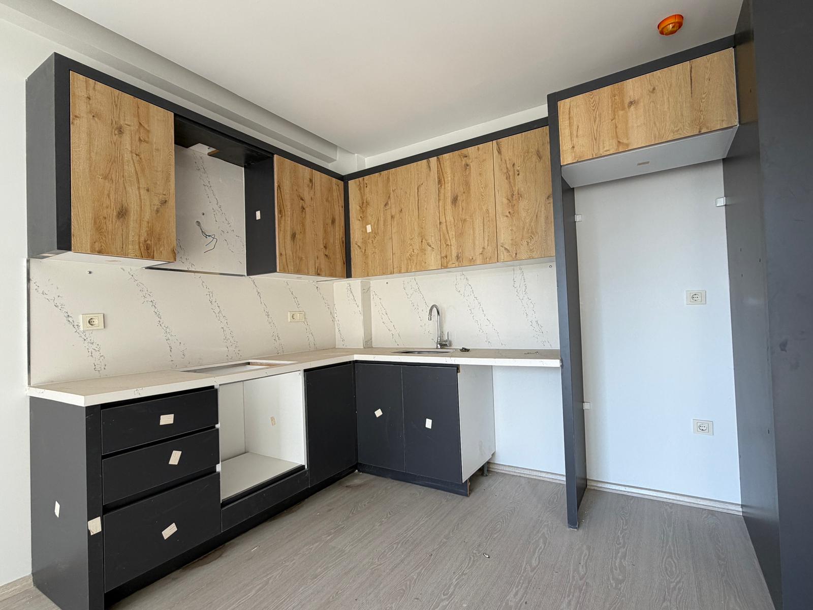 Moderne 1+1 lejlighed til salg i Mersin Tomuk nær havet