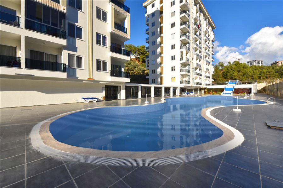 Современные апартаменты в Авсалларе с отельной инфраструктурой