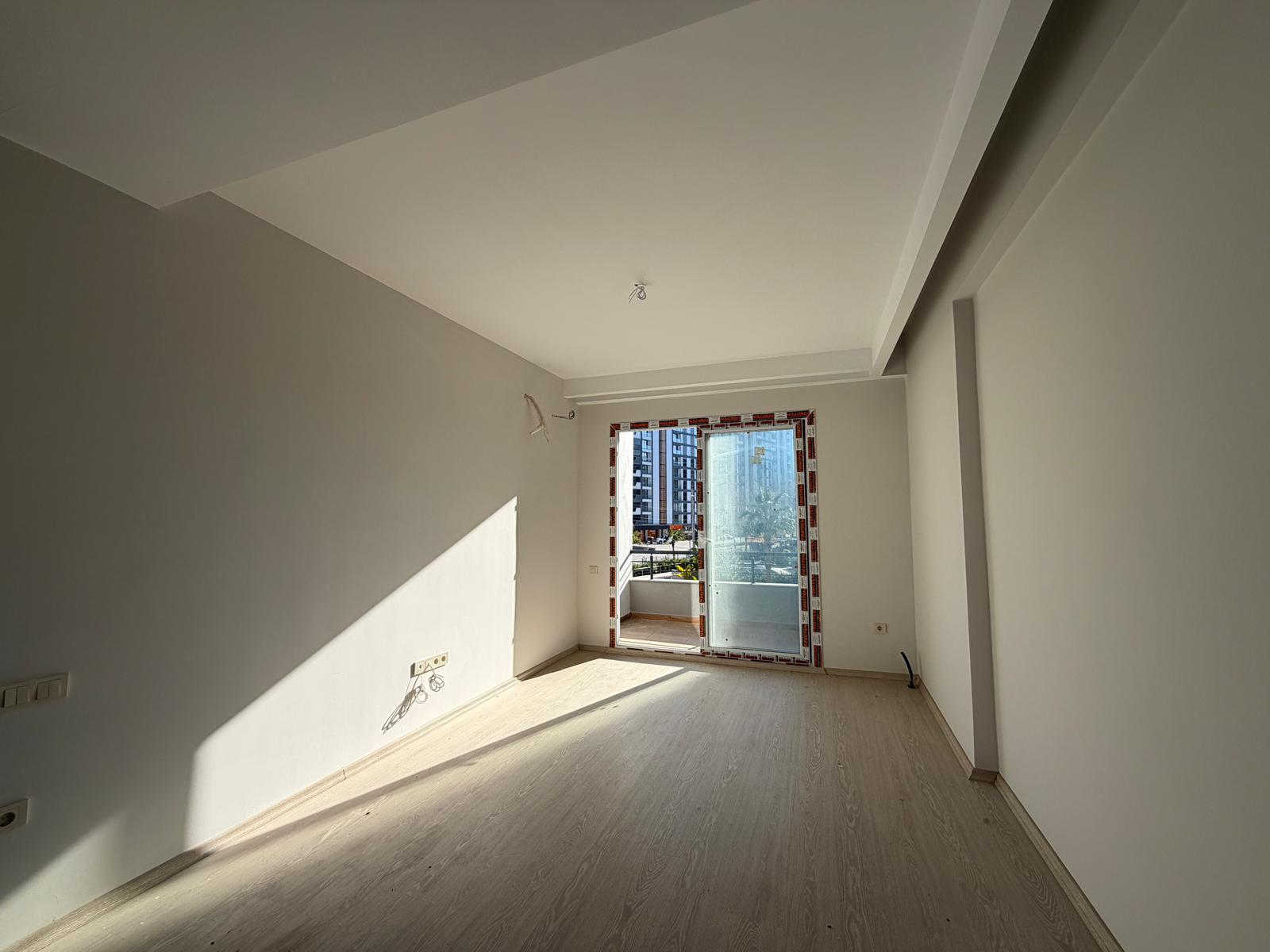 Moderne 1+1 lejlighed til salg i Mersin Tomuk nær havet